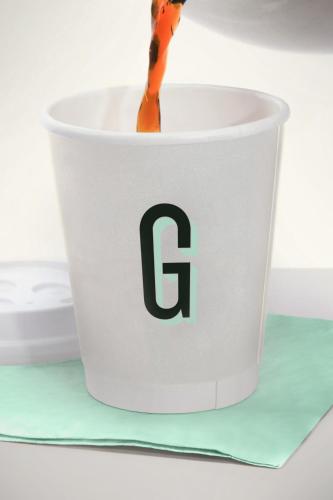 a coffee cup with a letter g on it at Garner Hotel Salt Lake City Airport by IHG in Salt Lake City