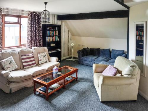 Et opholdsområde på Greenwood Cottage