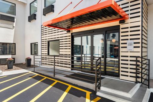 a view of a building with an orange awning at The Ellsworth Hotel, an Ascend Collection Hotel in Williams