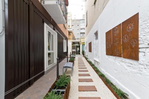 an empty alley with a bench on the side of a building at New Pescara City b&b in Pescara