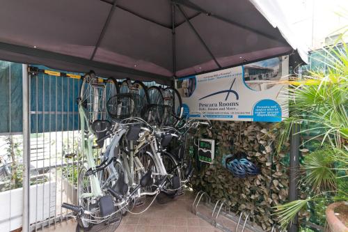 a group of bikes are lined up against a wall at New Pescara City b&b in Pescara