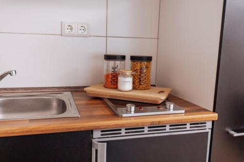 a small kitchen with a counter with a sink and a counter sidx sidx at classic & cream - Netflix - WIFI - City - 4 Person in Essen