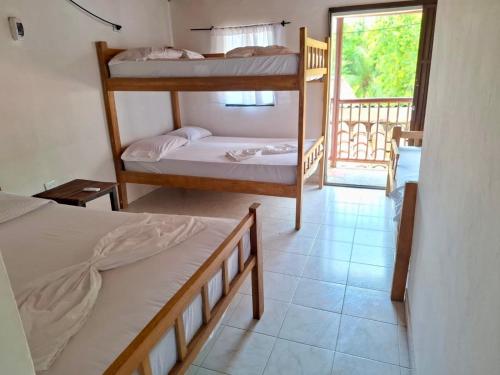 Ένα ή περισσότερα κρεβάτια σε δωμάτιο στο Borealis Apartahotel Tolú