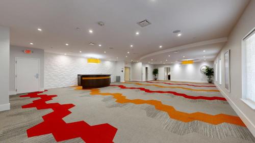 a large room with a large rug on the floor at Avanti International Resort in Orlando