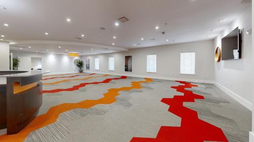 a large room with a large rug on the floor at Avanti International Resort in Orlando