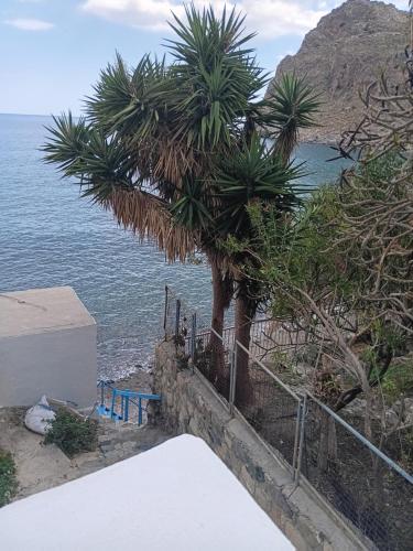a view of the ocean from the balcony of a house at Lendas Paradise studio 2 in Léntas