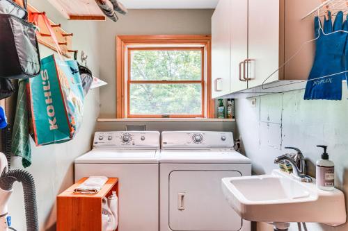 a kitchen with a washing machine and a sink at Peaceful Countryside Retreat with Yard in Frenchtown in Frenchtown