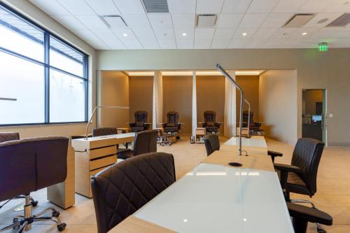 an office with desks and chairs and a large window at OKANA Resort and Indoor Waterpark in Oklahoma City