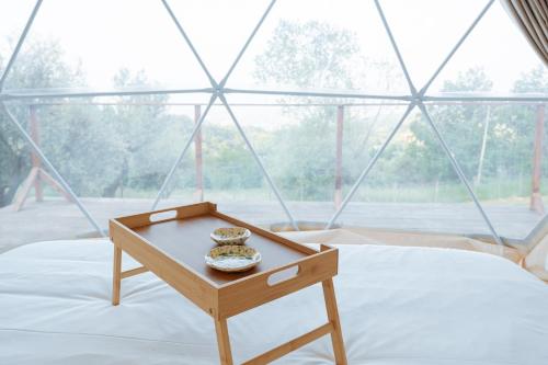 Postel nebo postele na pokoji v ubytování Soste in Quota Glamping