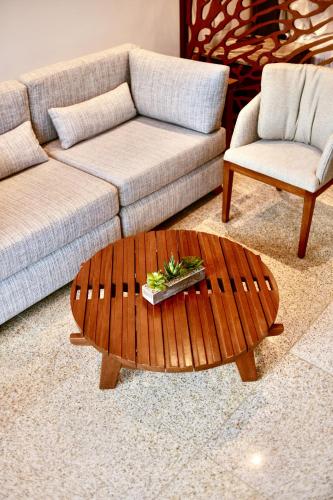 a living room with a couch and a coffee table at Castillete Hotel & Beach Club in Tierra Bomba