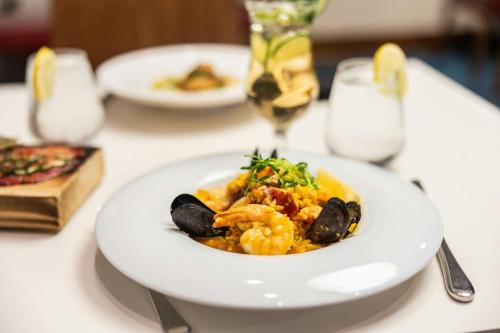 a white plate of food on a table at Delta Hotels by Marriott Prince Edward in Charlottetown
