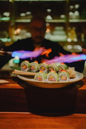 a plate of sushi on top of a table at Casa Las Tortugas Petit Beach Hotel & Spa in Holbox Island