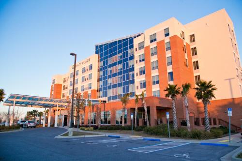 an empty parking lot in front of a building at Hyatt Place Pensacola Airport in Pensacola