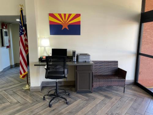an office with a desk with a laptop and a chair at Quality Inn & Suites Goodyear - Phoenix West in Goodyear