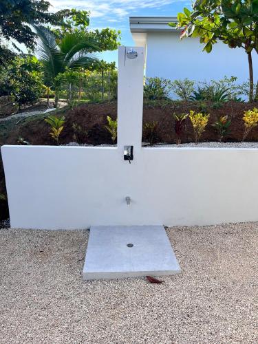 a white wall with a door on the side of it at Guanacaste Marbella luxury home with a private pool in Santa Cruz