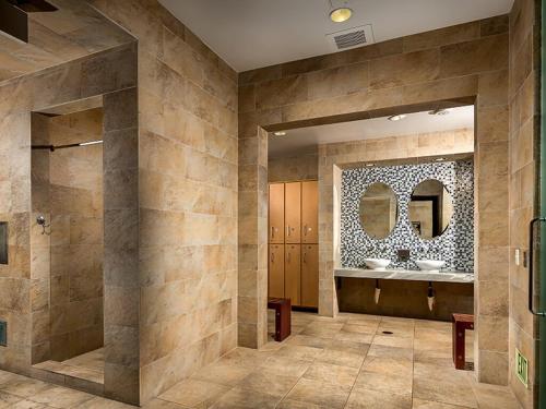 a bathroom with two sinks and a mirror at Designer 2 Bedroom with 3 Beds- Pool View, Gym, Parking in Los Angeles