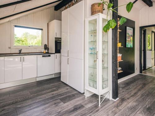 a kitchen with white cabinets and a window at 5 person holiday home in Silkeborg in Silkeborg