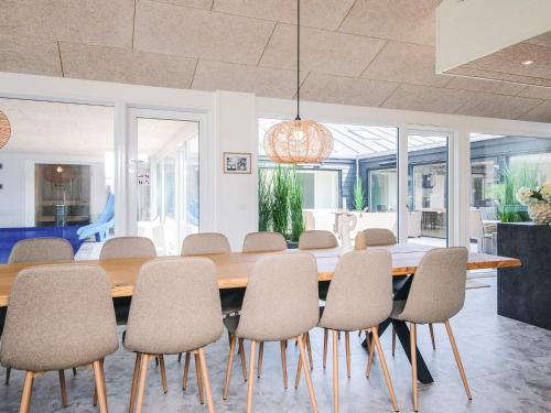 a dining room with a table and chairs at 5 star holiday home in Glesborg in Glesborg