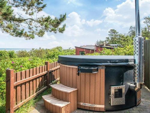 a wooden fence with aentedificialificialificialificialificialificialificialificialificialificial at 4 person holiday home in Glesborg in Glesborg