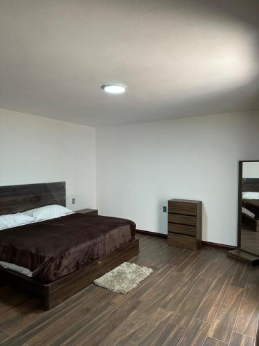 Кровать или кровати в номере Cabaña Casa Victoria