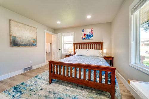 a bedroom with a wooden bed and a window at 3 Mi to Dtwn Family Home with Garden and EV Charger in Yakima