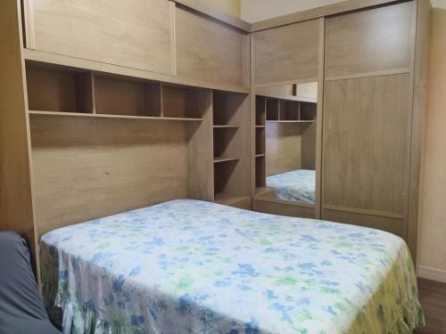 Ένα ή περισσότερα κρεβάτια σε δωμάτιο στο Apartamento temporada encantador, frente a praia