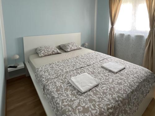 a bedroom with a bed with two towels on it at Apartment Starigrad 11683b in Starigrad