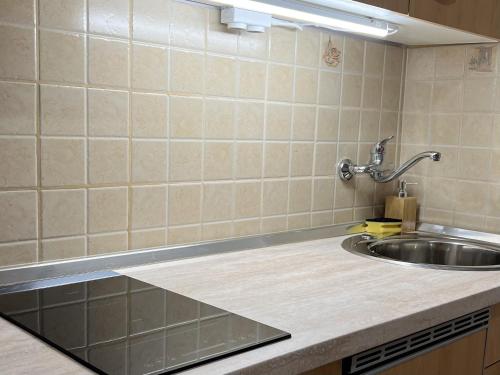 a kitchen with a sink and a counter top at Apartment Starigrad 11683b in Starigrad