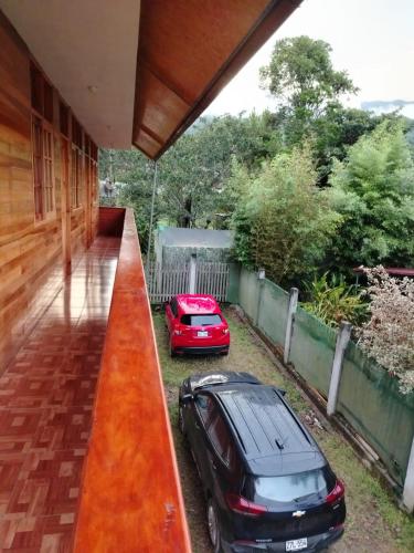 a car parked on the side of a house at Hospedaje Mariana oxapampa in Oxapampa