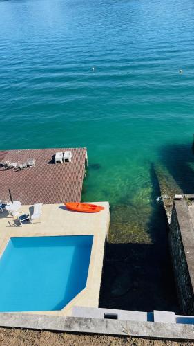 a swimming pool in the middle of a body of water at EXCLUSIVIDADE à beira-mar in Angra dos Reis
