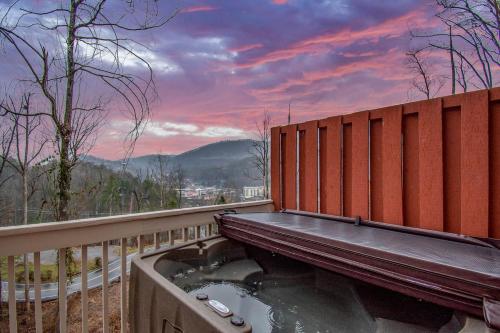 a wooden bench sitting on top of a fence at Cozy dwntwn chalet with mtn view GSMNP near Aquarium in Gatlinburg