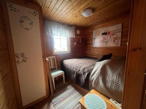 En eller flere senge i et værelse på 5 person holiday home in Bredaryd