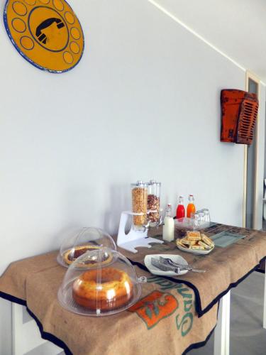 a table with bread and plates of food on it at Pekko in Spello