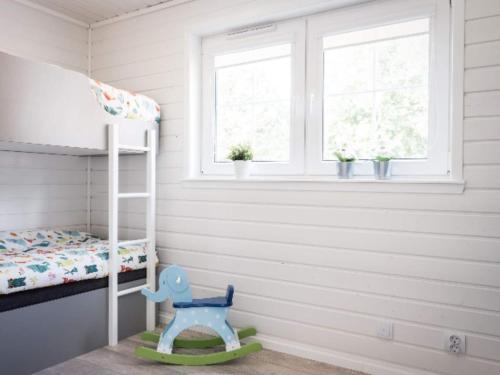 a childs room with a bunk bed and a window at 4 star holiday home in BRÅLANDA in Brålanda