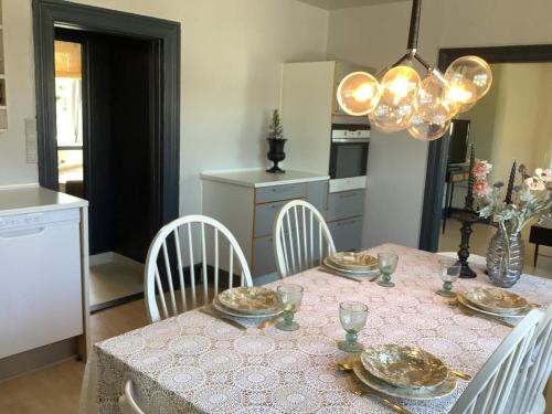a dining room with a table with chairs and a tableablish at 5 person holiday home in Snedsted in Snedsted
