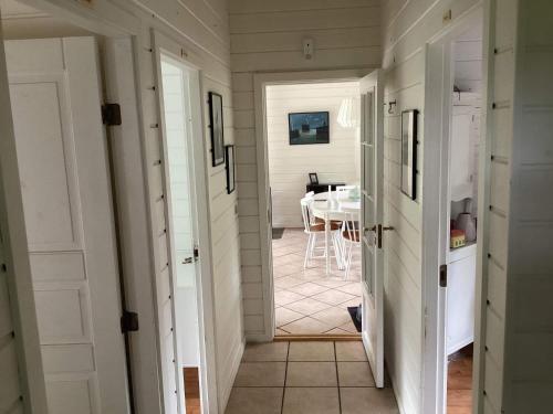 a hallway leading to a dining room with a table at 5 person holiday home in Nakskov in Nakskov