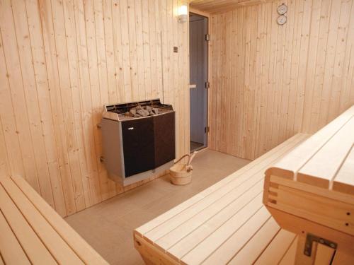 a inside of a sauna with a stove in it at 5 star holiday home in Thyborøn in Thyborøn