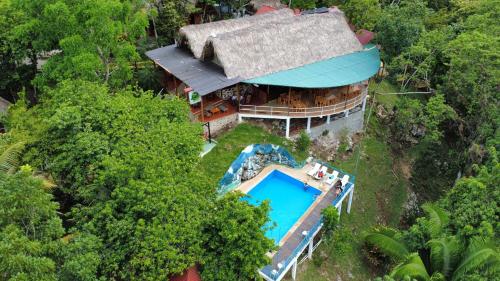 an overhead view of a house with a swimming pool at El Portal De Champey in Lanquín