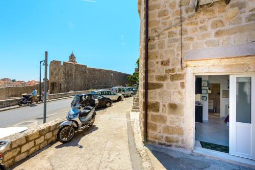 a motorcycle parked on the side of a building at Apartment MiNo in Dubrovnik