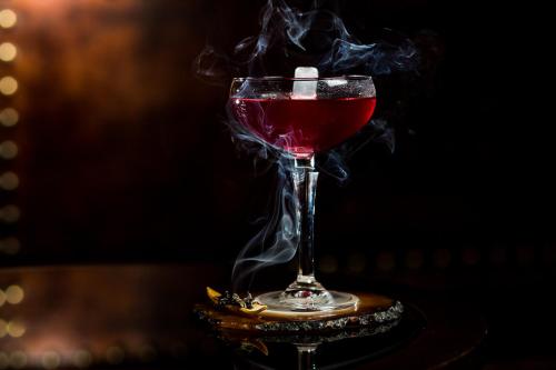a drink in a glass with smoke coming out of it at Grande Hotel Termas de Araxá in Araxá