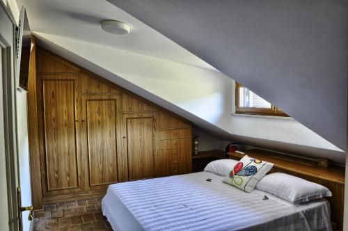 Säng eller sängar i ett rum på Locanda Colle Cerqueto