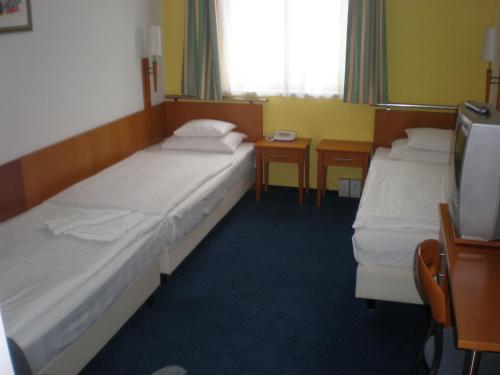 Кровать или кровати в номере Hotel Veritas