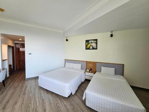 Ένα ή περισσότερα κρεβάτια σε δωμάτιο στο Sammy Hotel