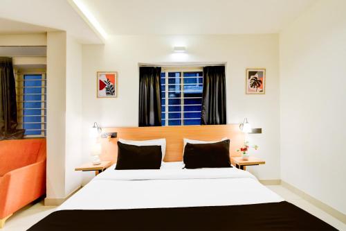 Katil atau katil-katil dalam bilik di Super Townhouse Casa Grand Miyapur