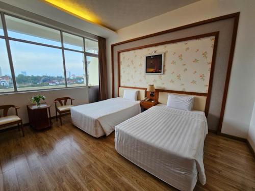 Ένα ή περισσότερα κρεβάτια σε δωμάτιο στο Sammy Hotel