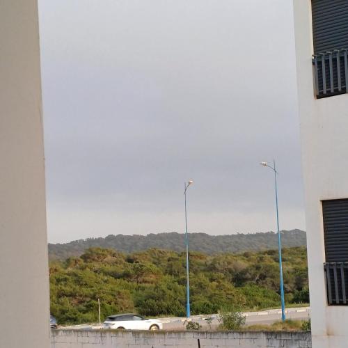 a view of a street with two street lights at Charmant studio familial mehdia plage in Kenitra