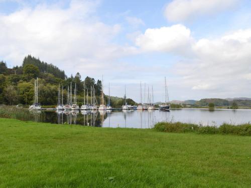 a view of a marina with boats in the water at Printmakers Cottage in Bellanoch