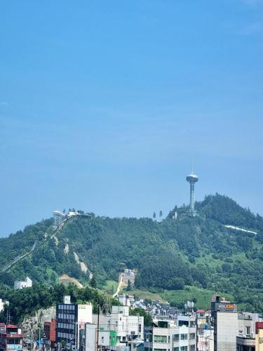 a city with a water tower on top of a hill at Wandonesia in Wando