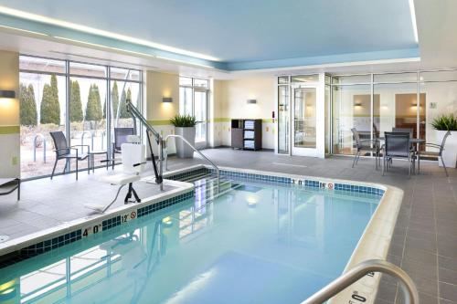 a large swimming pool in a hotel room at Fairfield Inn & Suites by Marriott Springfield Northampton/Amherst in Northampton