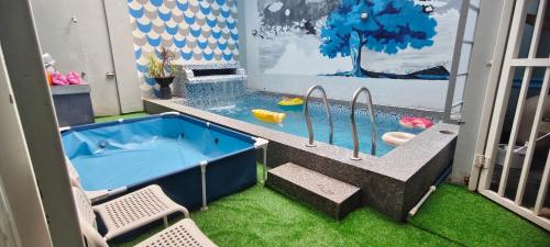 a jacuzzi tub in the middle of a room at M3 Private Villa in Angeles